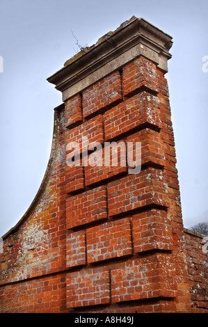 A OLD RED BRICK GATEWAY PILLAR IN NEED OF RESTORATION TO CORRECT ITS LEANING AT HALSWELL HOUSE NEAR BRIDGWATER SOMERSET Stock Photo