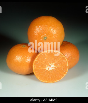 Group of whole cut sectioned mandarin fruit variety Ellendale Stock Photo