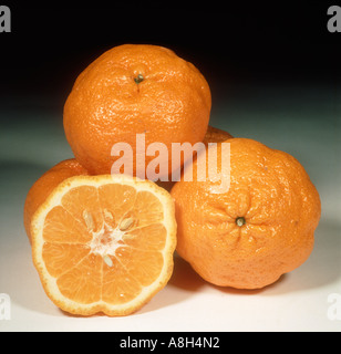 A group of whole sectioned mandarin fruit variety Malaquinas Stock Photo