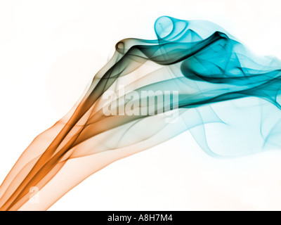 Colorized incense smoke trails on a white background Stock Photo