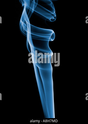 Colorized incense smoke trails on a black background Stock Photo