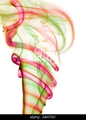 Colorized incense smoke trails on a white background Stock Photo