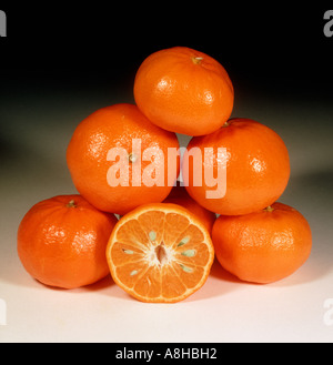 Group of mandarin fruit whole sectioned variety Sunburst Stock Photo