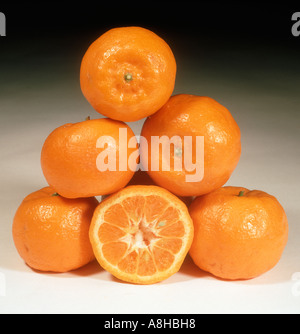 Group of mandarin fruit whole sectioned variety Kinnow Stock Photo