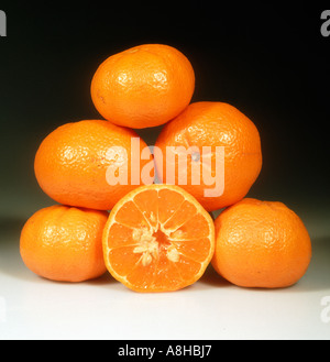 Group of mandarin fruit whole sectioned variety Malvasio Stock Photo