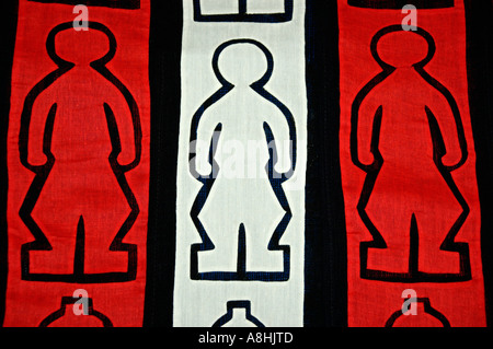 Red and white handwoven fabric with men-shaped pattern Luang Prabang Laos Stock Photo