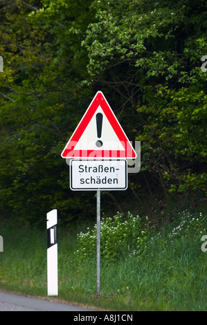 German autobahn sign Strassen Schaden - dangerous roads warning Germany Europe Stock Photo