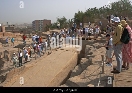 Tourists looking at the unfinished Obelisk Aswan Upper Egypt North Africa Middle East Stock Photo