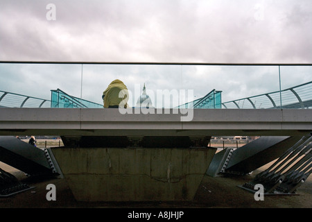 a homeless person on the Millenium Bridge in London. Stock Photo