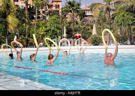 holidaymakers do aquarobics in a swimming pool in Tenerife, Spain Stock Photo