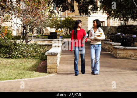 Students carrying each other on campus Stock Photo - Alamy