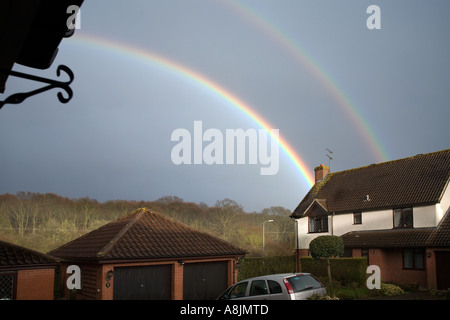 Double Rainbow over houses Stock Photo