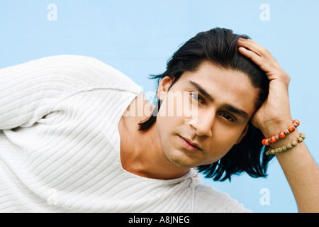 Portrait of a young man lying on side Stock Photo