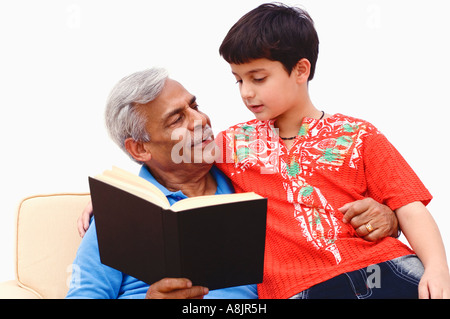 Senior man teaching hid grandson Stock Photo