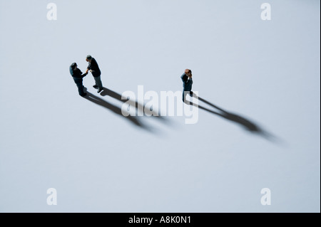 models of businessmen in group viewed from above Stock Photo