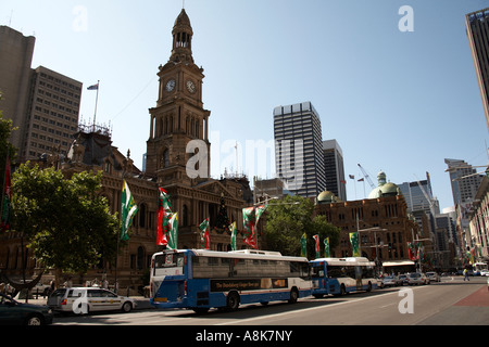 Town Hall with buses and Christmas banners on George St in Sydney city centre New South Wales NSW Australia Historic landmark Stock Photo