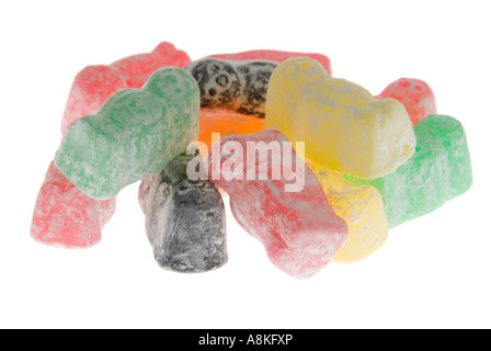 Horizontal close up of a pile of powdery multi coloured jelly babies on a white background Stock Photo