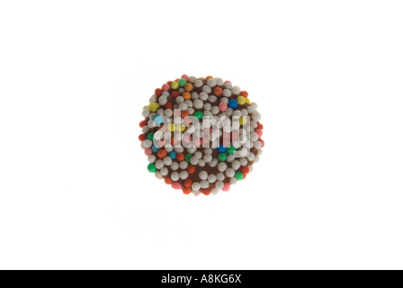 Horizontal close up of one milk chocolate button on a white background. Stock Photo