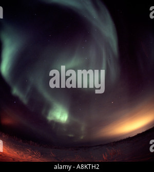 Abstract shapes of green glow created in the sky - the northern lights Stock Photo