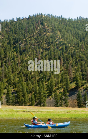 IDAHO MAIN SALMON RIVER Dad and son kayaking on a sunny day MR Stock Photo