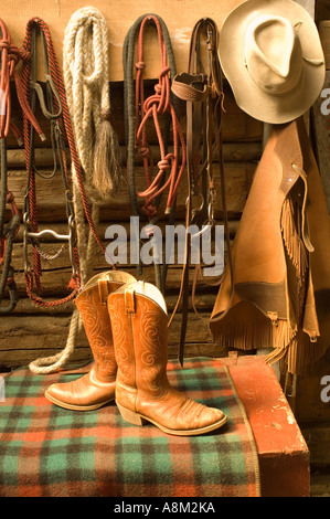 IDAHO INDIAN CREEK GUEST RANCH Colorful array of boots and wrangler gear in tack shack near the Main Salmon River Stock Photo