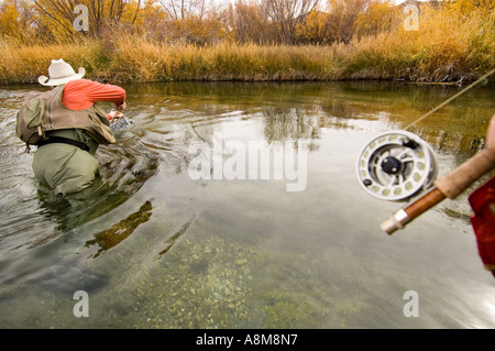 Idaho Silver Creek near Sun Valley two men in float tubes smile while fly  fishing in autumn Stock Photo - Alamy