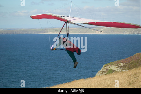 Hanggliding off Atlantic cliffs at St Agnes Head nr St Agnes Cornwall Great Britain Stock Photo