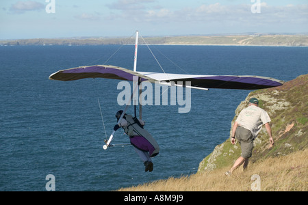 Hanggliding off Atlantic cliffs at St Agnes Head nr St Agnes Cornwall Great Britain Stock Photo