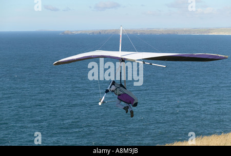 Hanggliding off Atlantic cliffs at St Agnes Head nr St Agnes Cornwall Great Britain Stock Photo