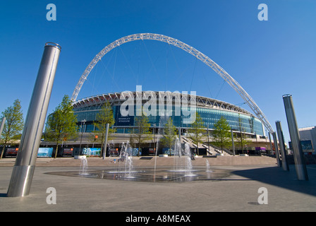 Horizontal wide angle of fountains outside the entrance of the new Wembley Stadium on a bright sunny day Stock Photo