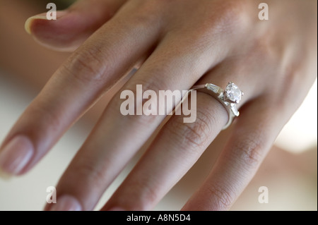 Woman s hand wearing an engagement ring Stock Photo