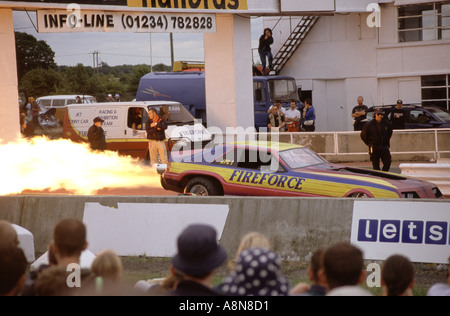The FireForce Jet Car team prepare for the race and excite the crowd with noise and flames at Bug Jam 2001, Santa Pod Raceway, E Stock Photo