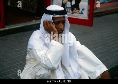 Dubai UAE Local Man On Mobile Souk Area Stock Photo
