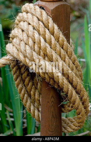 Rope coil on post Stock Photo