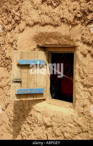 This window on the world is the view looking into a mud house dwelling in Larabanga, Northern Region, Ghana, West Africa. Stock Photo