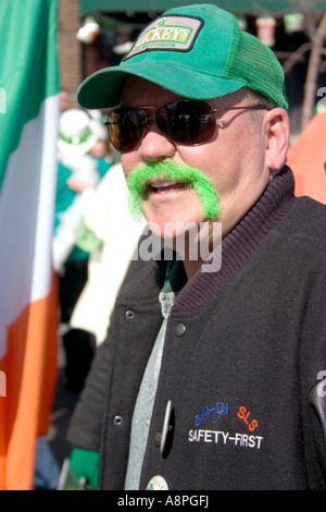 St. Patrick's Day parade man sporting dyed green mustache. St Paul Minnesota USA Stock Photo