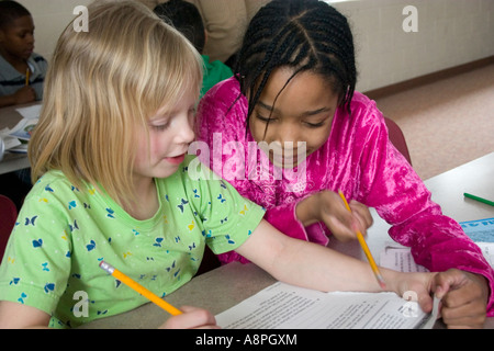 Students working on homework after school. After School Study Program. St Paul Minnesota USA Stock Photo