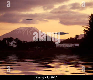 UFO sighting over volcano Stock Photo