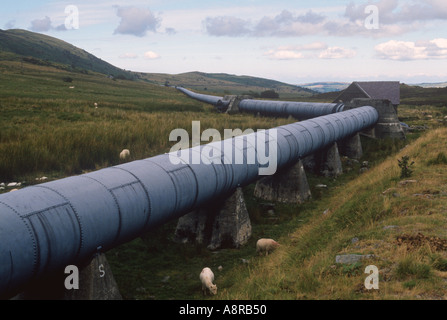 Pipes carrying water from Llyn Cowlyd Reservoir in the Cambrian Mountains Gwynedd  Stock Photo