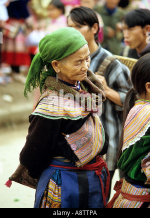 Portrait of traditionally dressed elderly Flower Hmong woman at Sunday market, Bac Ha, NW Viet Nam Stock Photo