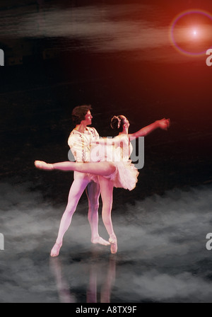 Male and female ballet partners performing on stage Stock Photo