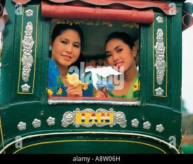 Philippines. Manila. Two young women rickshaw ride. Stock Photo