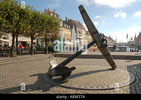 This large ship's anchor at one end of Nyhavn Copenhagen's scenic new harbour commemorates Danish sailors killed in World War II Stock Photo