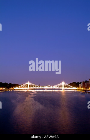 The Albert Bridge over the Thames River in London at dusk. Stock Photo