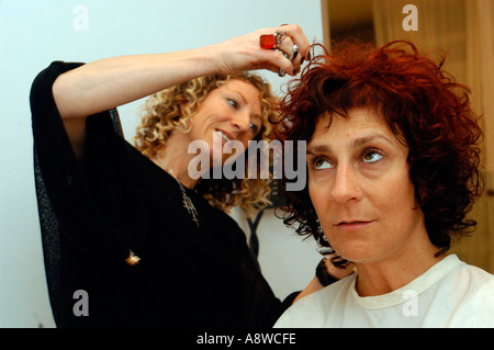 Customers at the Devachan Salon in Soho get their hair styled  Stock Photo