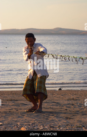 Man Preparing His Fishing Nets Stock Photo