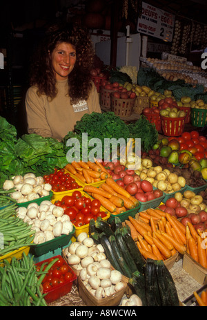 French-Canadian woman, French-Canadian, woman, adult woman, vegetable vendor, selling vegetables, Atwater Market, Montreal, Quebec Province, Canada Stock Photo