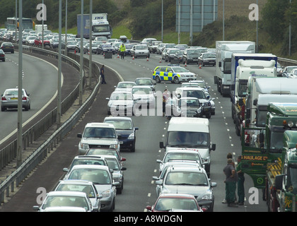 Closed motorway due to an accident with Congestion bored motorist caught up in a long tailback people pollution climate change Stock Photo