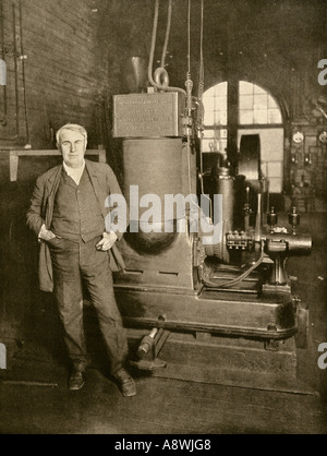 Thomas Edison with his dynamo that generated the first commercial electric light New York City. Halftone reproduction of a photograph Stock Photo