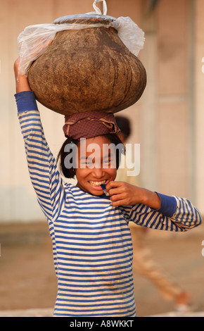 Asia, Myanmar, Monywa, Young girl with thanaka face paint Stock Photo